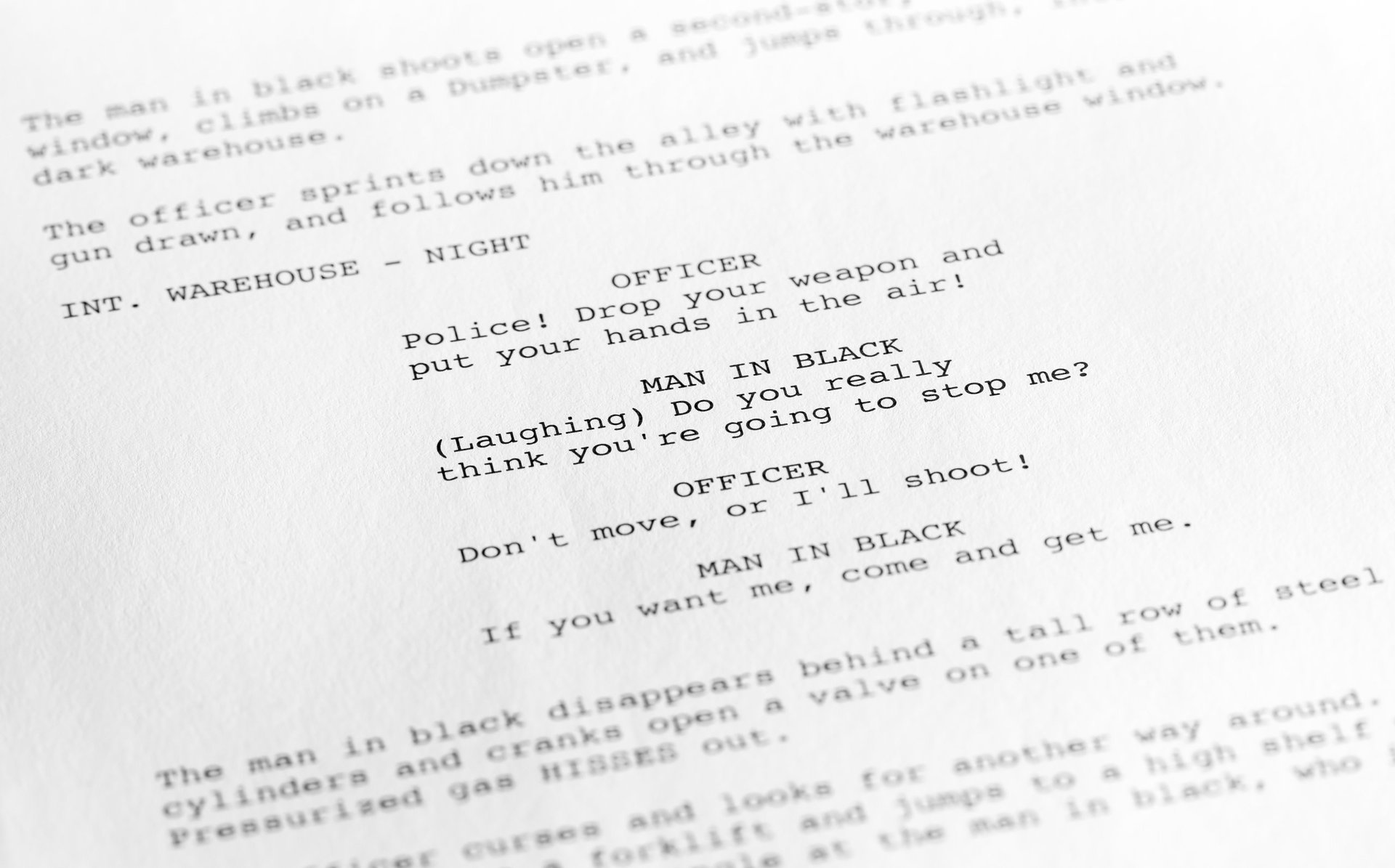 Close-up of a page from a screenplay or script in proper Hollywood format