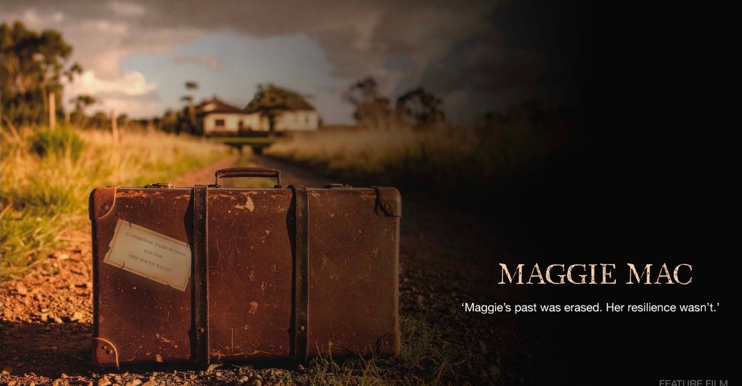 Weathered brown suitcases on dusty road with abandoned homestead in background